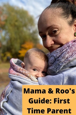 Mother holding child in babywearing sweatshirt with Wild Wine Vineyard accents. Text reads, "Mama & Roo's Guide: First Time Parent"