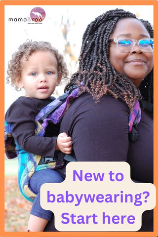 A Black mother carries her biracial baby on her back in a Jurassic Park - New Era soft structured baby backpack carrier (the LennyGo).  Text reads, "New to babywearing? Start here" "Mama & Roo's ethically made joyfully carried"