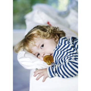 Baby using Natursutten rubber Original pacifier. Made in Italy.