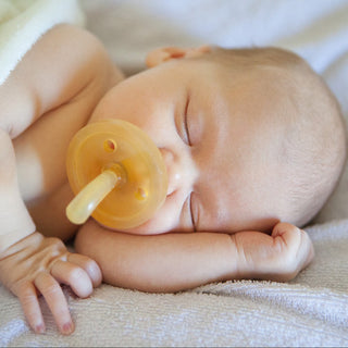 Newborn baby using Natursutten rubber Original pacifier. Made in Italy.