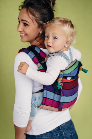 Model is back carrying child in Lenny Lamb buckle onbuhimo in print Carousel of Colors