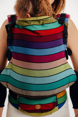 Lenny Lamb preschool carrier in print Carousel of Colors, with horizontal bands of color separated by thin black accent stripes