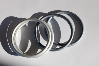 Medium silver sling rings (left) next to Medium Slate sling rings (right)