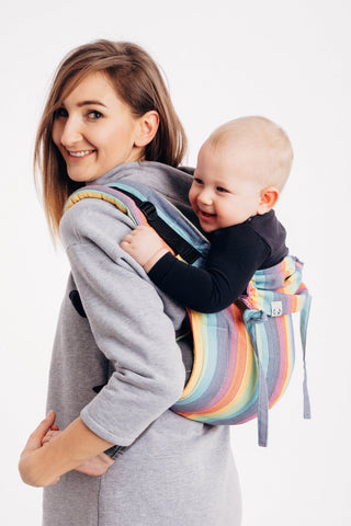 Lenny Lamb brand buckle onbuhimo baby carrier in print Luna. Model is wearing winter dress. White background. Close up side view