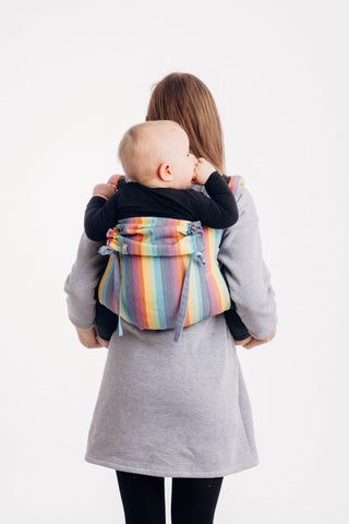 Lenny Lamb brand buckle onbuhimo baby carrier in print Luna. Model is wearing winter dress. White background. full back view
