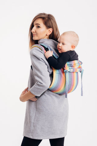 Lenny Lamb brand buckle onbuhimo baby carrier in print Luna. Model is wearing winter dress. White background. side view