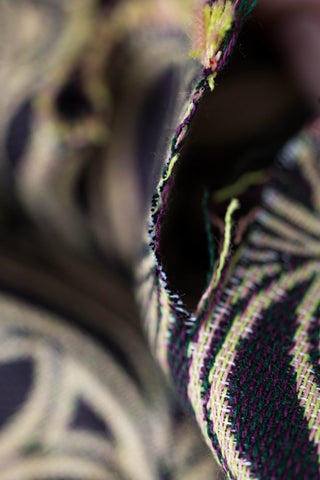 Wrap conversion baby ring sling carrier in limited edition pocket weave print Infinity- Timeless. Fabric closeup